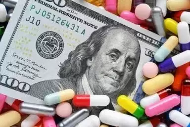 Trulicity lawsuit: hundred dollar bill laying on top of multi colored capsules